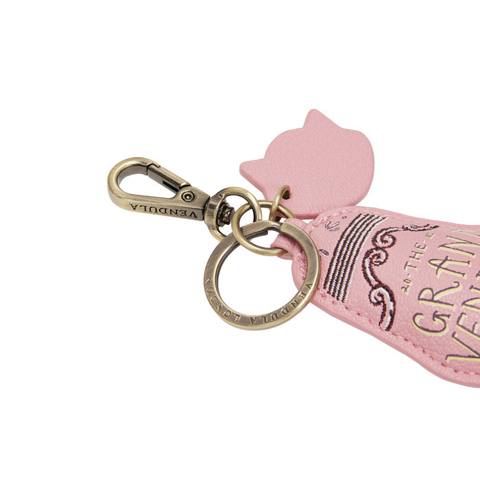 Pink keychain with gold clasp on a white background