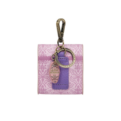 Purple keychain with floral pattern on a white background