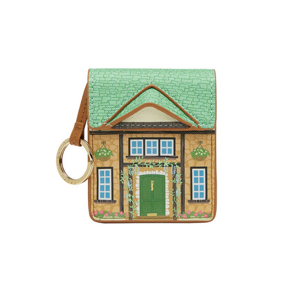House-shaped keychain with a green roof and brown door on a white background