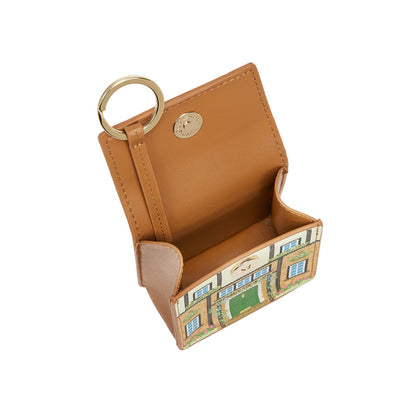 Tan leather cardholder with geometric pattern on a white background
