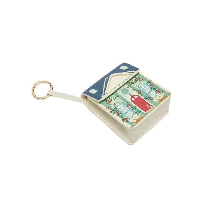 Small book-shaped keychain with a colorful design on a white background