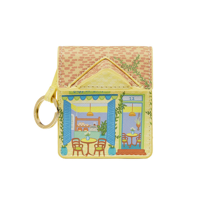 Keychain with a design of a house with a patio scene on a white background