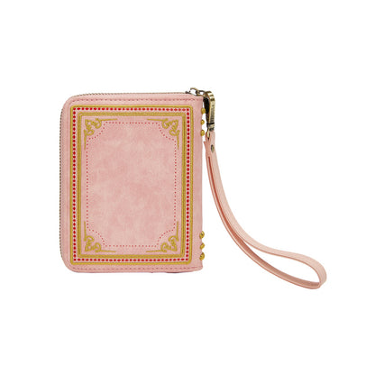 Pink wallet with decorative border and wrist strap on a white background