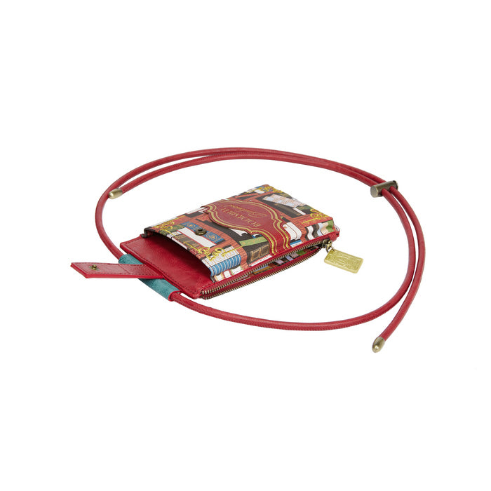 Red crossbody bag with colorful patterned flap on a white background