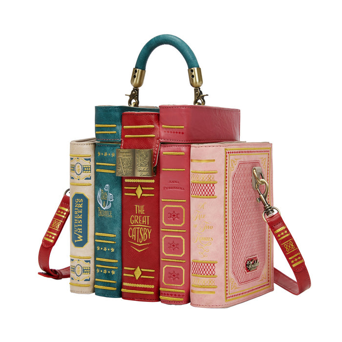 Book-shaped handbag with a strap on a white background