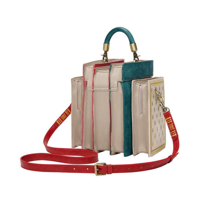 Book-shaped handbag with a red strap on a white background