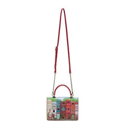 Handbag with colorful architectural design on a white background