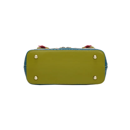 Green handbag with decorative elements on a white background