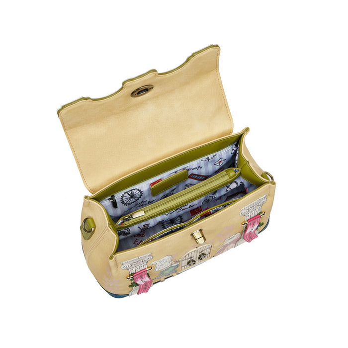 Open beige handbag with floral pattern on a white background