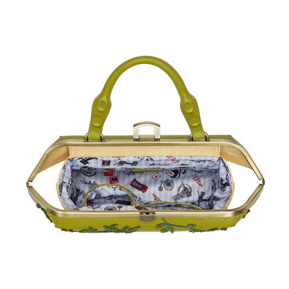 Green handbag with a white interior featuring cartoon designs on a white background