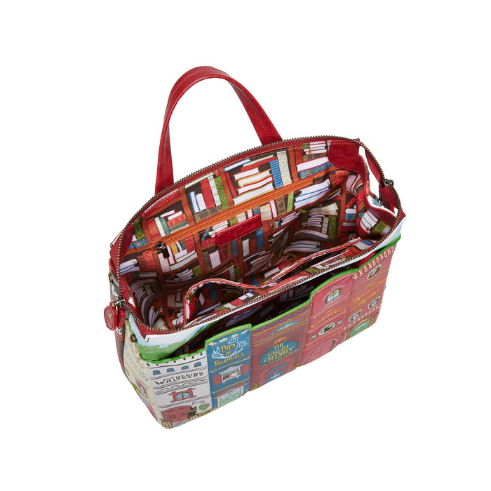 Colorful book-themed tote bag with open front pocket on a white background