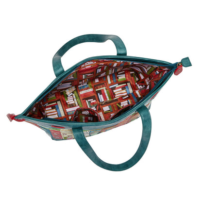 Open teal bag with colorful book pattern interior on a white background