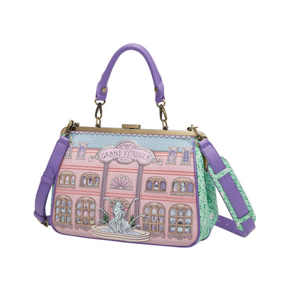 Handbag with a design of a building and fountain on a white background