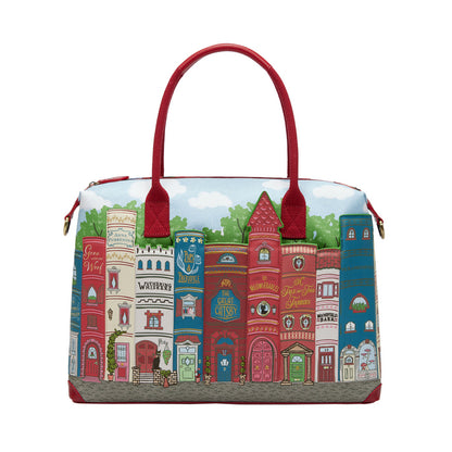 Handbag with colorful architectural design on a white background