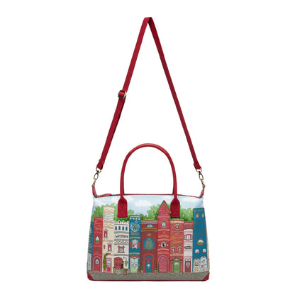 Handbag with a colorful cityscape design on a white background
