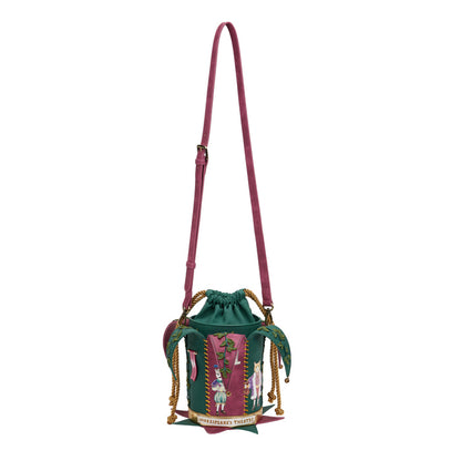 Green drawstring bag with pink strap on a white background