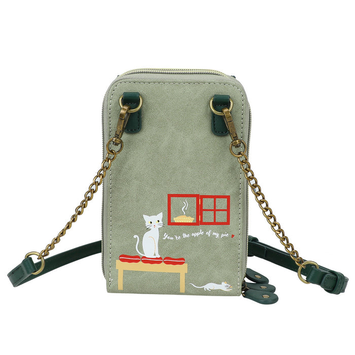 Green crossbody bag with cat illustration on a white background