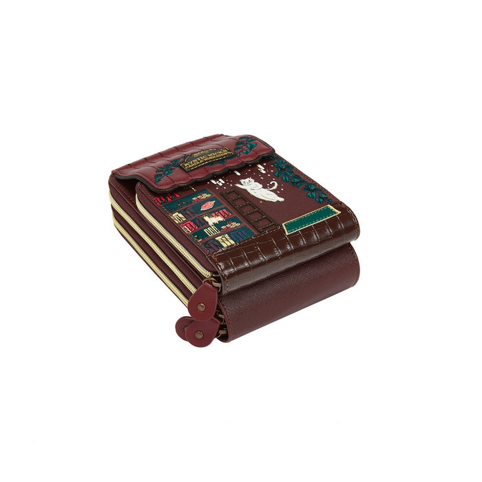 Brown leather wallet with decorative patterns on a white background