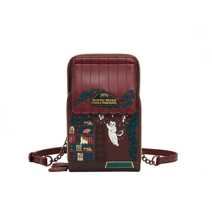 Brown leather bag with decorative elements and a brand logo on a white background