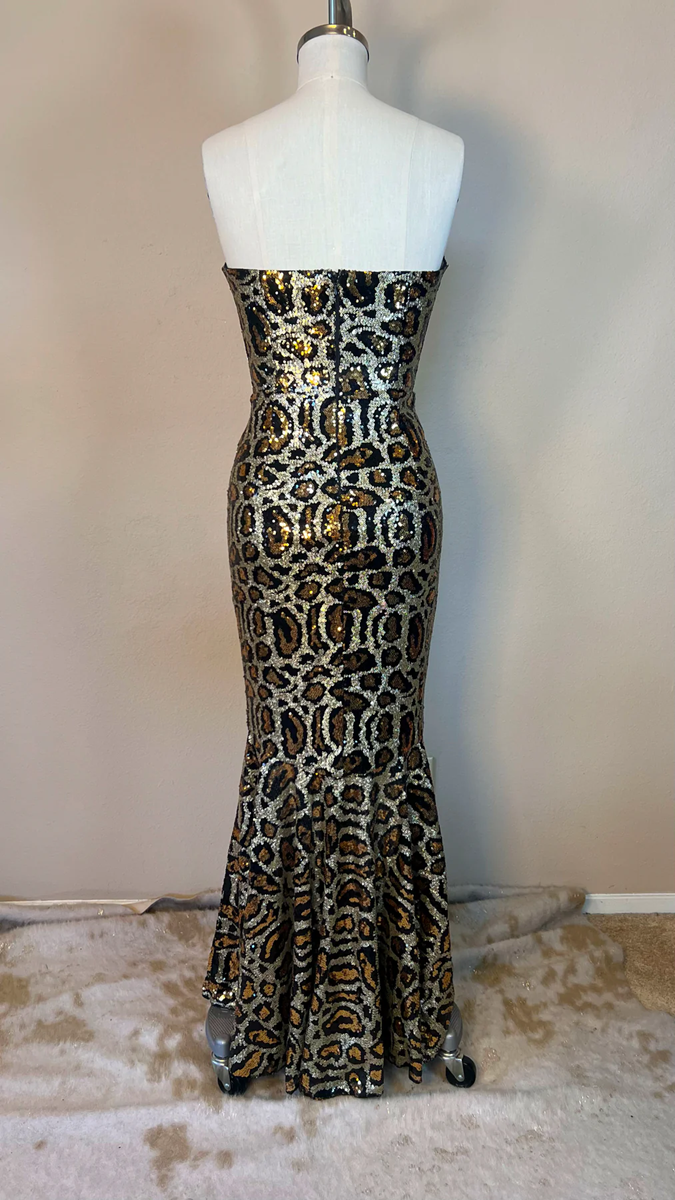 Leopard print strapless gown on a mannequin against a neutral background