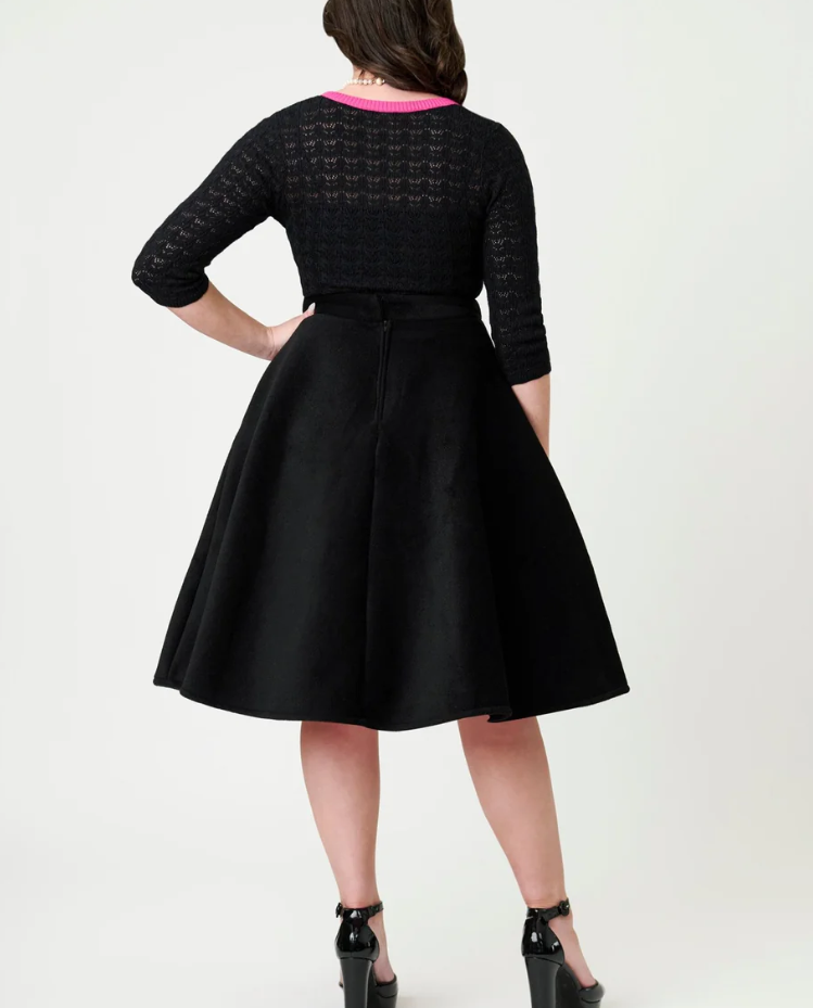 Black dress with a textured pattern on a white background