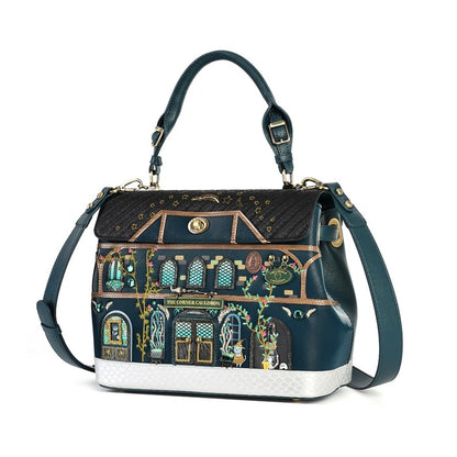 A dark teal leather handbag featuring a detailed architectural illustration of 'The Chinese Garden' on the front flap, with gold accents and a white textured base, shown on a plain white background.
