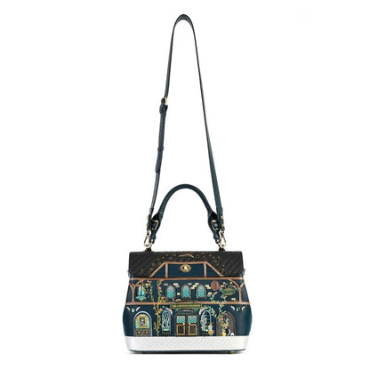 A structured handbag with a dark navy blue base, featuring an ornate, colorful architectural illustration on the front resembling a classic building facade. The bag has a black top handle, a long black shoulder strap, and gold-tone hardware.