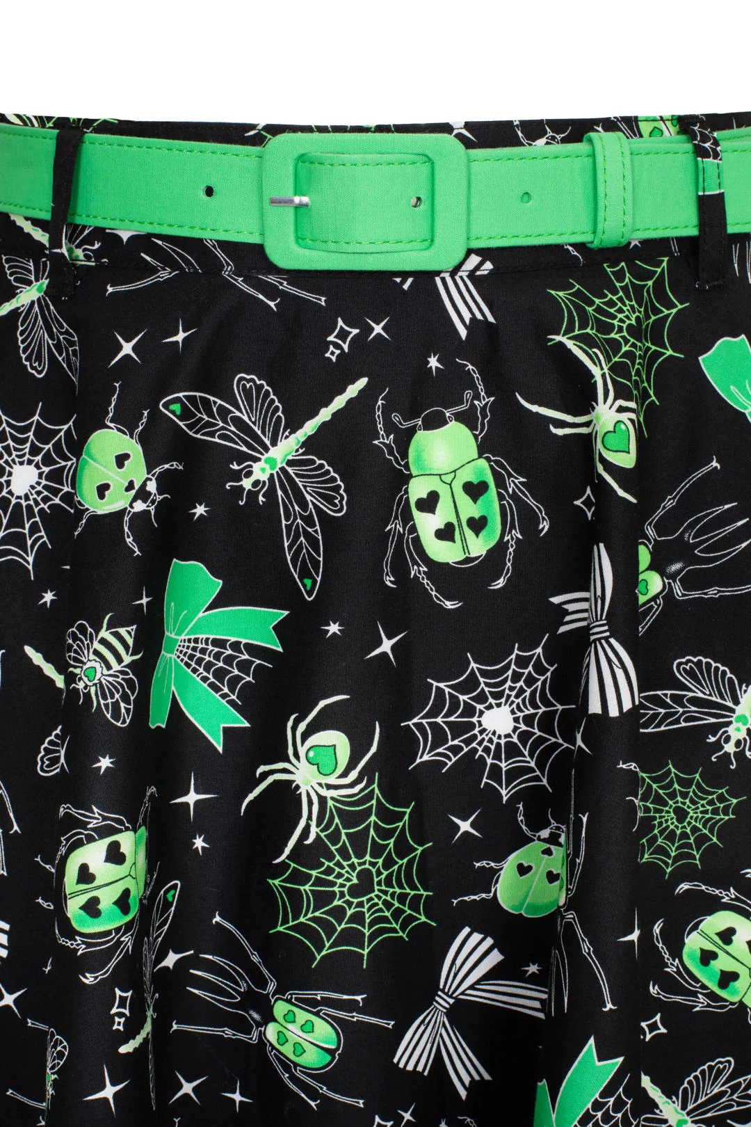 Black skirt with green and white insect pattern, worn with a green belt.