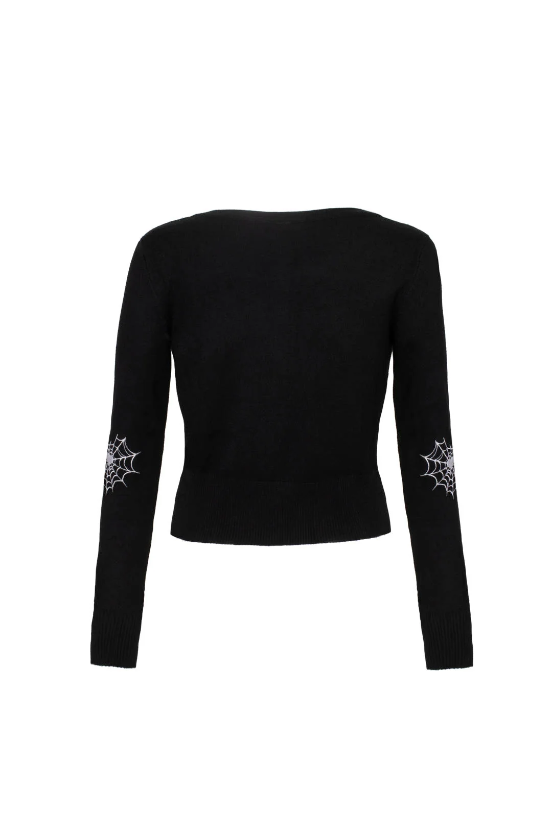 A woman modeling a black long-sleeve knit top with green and white spider-themed embroidery on the chest and sleeves, paired with black pants, against a light gray studio background.