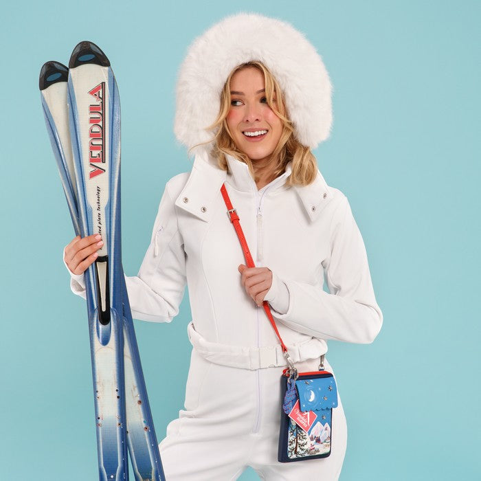 VENDULA SLOPES compact organiser with a front phone pocket, ziparound compartment, multiple internal pockets, mirror and detachable crossbody strap. Embroidery and appliqué add texture to artwork featuring snowy peaks, chalet scenes, gondolas and ski-route details.