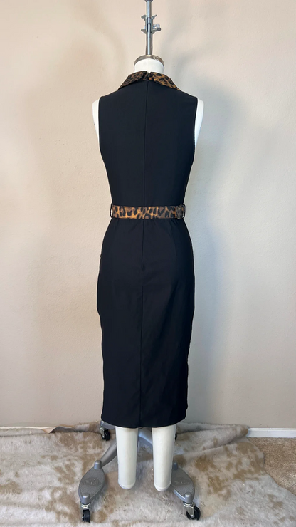 Black dress with a leopard print belt on a mannequin against a beige wall.