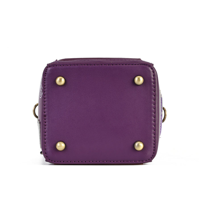 A purple leather handbag shown from the bottom front view, featuring four brass studs on the face and a small gold ring handle on the sides, set against a plain white background.