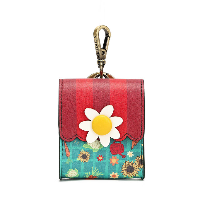 A small card holder wallet with a red and teal floral design, featuring a large white daisy flower applique on the front and a gold-tone carabiner clip at the top.