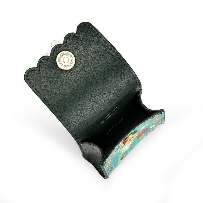 A dark green leather key holder with a scalloped edge and a gold-tone snap button, shown open to reveal a colorful patterned interior.