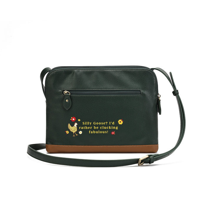 A dark green faux-leather crossbody bag with a brown leather base trim, featuring a front zip pocket with a small embroidered chicken and the phrase 'Silly Goose? I'd rather be ducking fabulous!' in yellow and red.