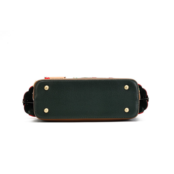 The bottom view of a dark green pebbled leather handbag showing the metal studs and a glimpse of the red and black patterned lining along the sides, set against a plain white background.