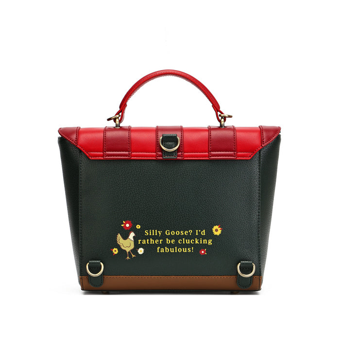 A structured handbag with a black pebbled leather body, a bright red top handle and upper flap, and a brown base trim. The front features a humorous text print in yellow and red with a small rooster illustration.
