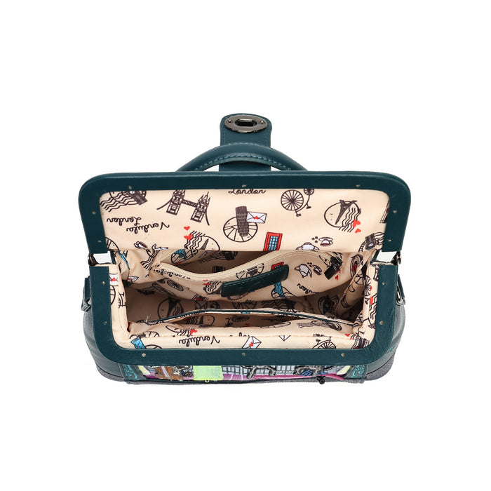 An open vintage-style clutch or small suitcase with a dark teal exterior and a beige interior printed with black bicycle and London-themed illustrations, shown against a plain white background.