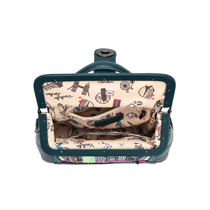 An open vintage-style clutch or small suitcase with a dark teal exterior and a beige interior printed with black bicycle and London-themed illustrations, shown against a plain white background.