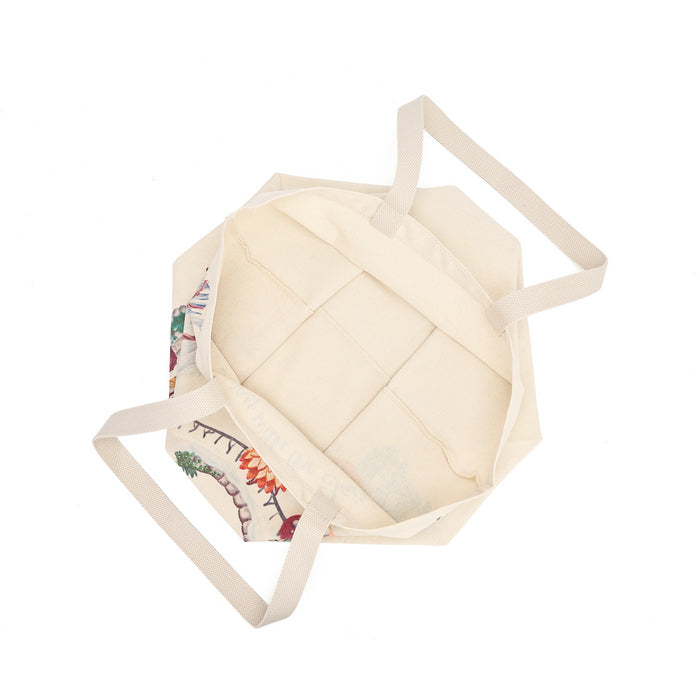 A lightweight recycled-canvas tote with a digital print featuring snowy toadstool houses, fairy doors, winter trees, rabbits and snowflakes. The roomy format is suited to shopping, errands or carrying extra everyday items.