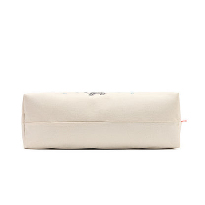 A cream-colored canvas zippered pouch with a small black graphic and a tiny red tag on the right side, shown against a plain white background.