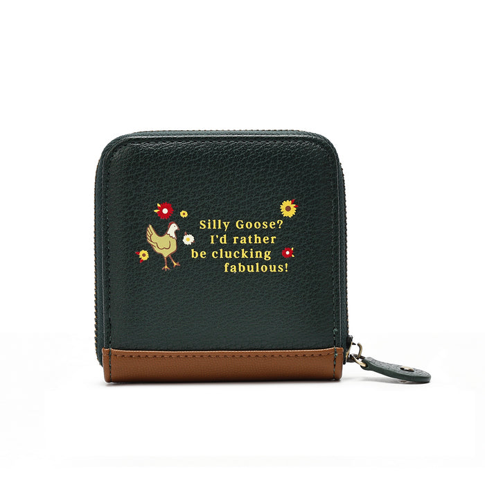 A dark green textured zip-around wallet with a brown leather base trim and a small embroidered design featuring a chicken, flowers, and the text 'Silly Goose! I'd rather be clucking fabulous!'.