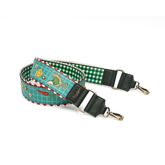 A fabric pet collar strap with a green and white gingham pattern, a teal side with a bird and vegetable print, and dark green faux-leather ends with white stripes and gold-tone hardware.