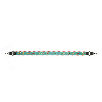 A horizontal strap featuring a turquoise blue background with a repeating pattern of small embroidered flowers and leaves in yellow, green, and orange. The strap has black plastic hardware on both ends with silver metal hooks.
