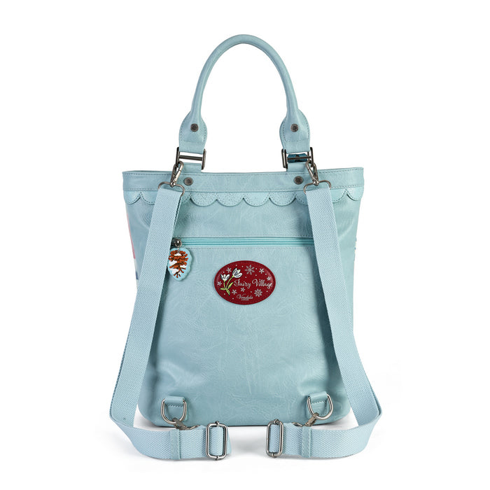 A versatile carryall that can be worn as a backpack, shoulder bag, crossbody or grab tote, with a padded tech section and organised internal storage. Embroidery and appliqué add texture to artwork featuring snowy toadstool houses, fairy doors, winter trees, rabbits and snowflakes.