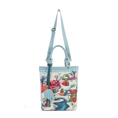 A versatile carryall that can be worn as a backpack, shoulder bag, crossbody or grab tote, with a padded tech section and organised internal storage. Embroidery and appliqué add texture to artwork featuring snowy toadstool houses, fairy doors, winter trees, rabbits and snowflakes.