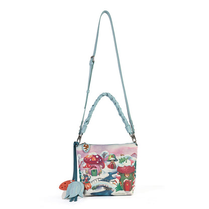A practical crossbody with a top handle, detachable strap and a mix of internal and external pockets for everyday organisation. Printed and embossed vegan leather is finished with snowy toadstool houses, fairy doors, winter trees, rabbits and snowflakes.
