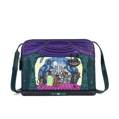 A purple and dark teal messenger bag featuring a detailed illustrated scene on the front depicting a cat in a magician's hat, a rabbit, and a mouse on a stage, with the text 'The Great Cat Show'.