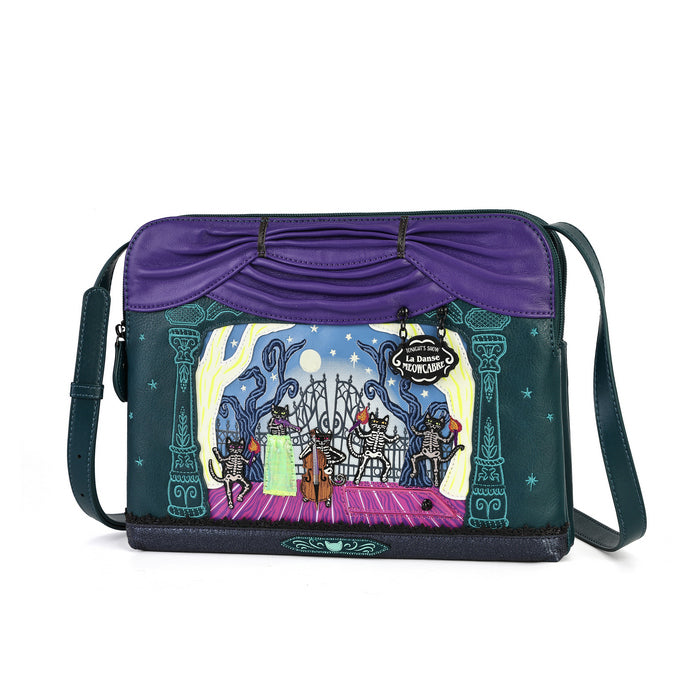 A purple and dark teal messenger bag featuring a detailed graphic illustration of a cat band performing on stage, with a purple faux-leather top panel and a dark teal shoulder strap.