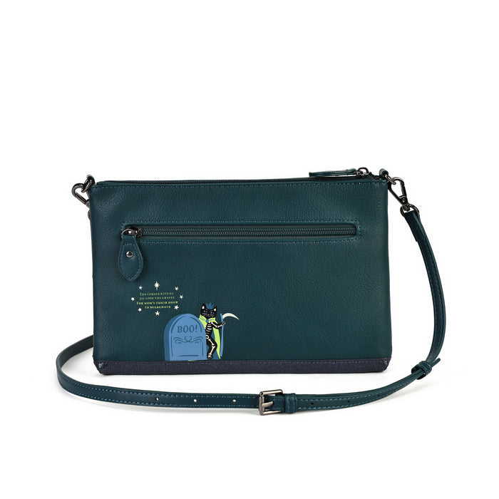 A dark teal leather crossbody bag with a front zippered pocket and an illustrated tombstone graphic on the lower front, shown on a clean white background.